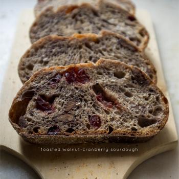 Enzo the Third Normandy Apple bread, 50% whole wheat batard, walnut-cranberry sourdough, olive sourdough bread first slice